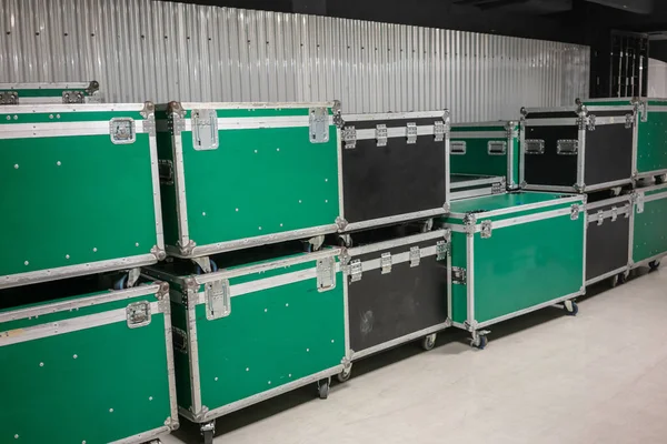 Set of green and black aluminum wooden flight cases. Musical instrument cases.