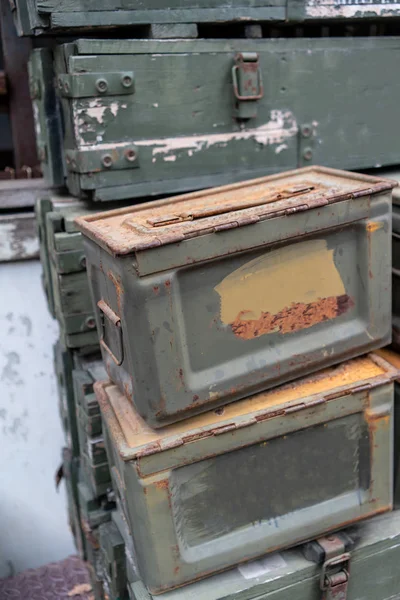 Military green ammunition boxes.