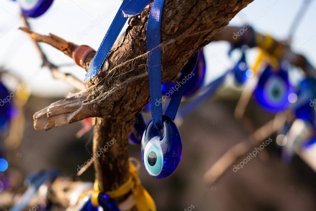 Evil eye beads hanging on the branch in Cappadocia