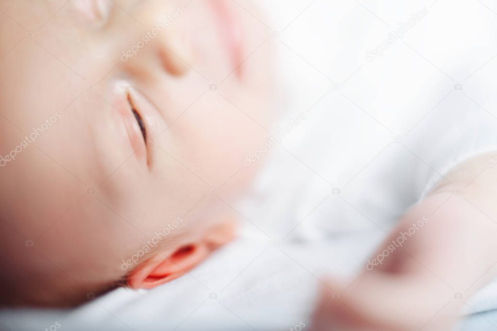 Portrait of a sleeping baby boy. Man was born. Family life.