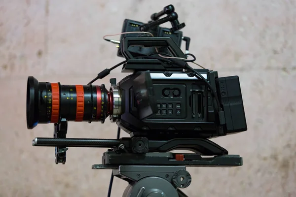 Process of filming. Big movie camera on a tripod.