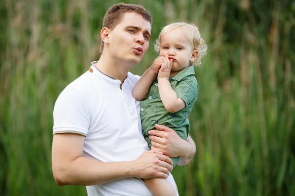 Father Holds His Little Son His Arms Reeds Background Walk — Stock Photo, Image