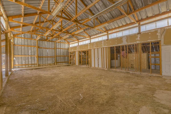 Interior of empty barn wooden beams