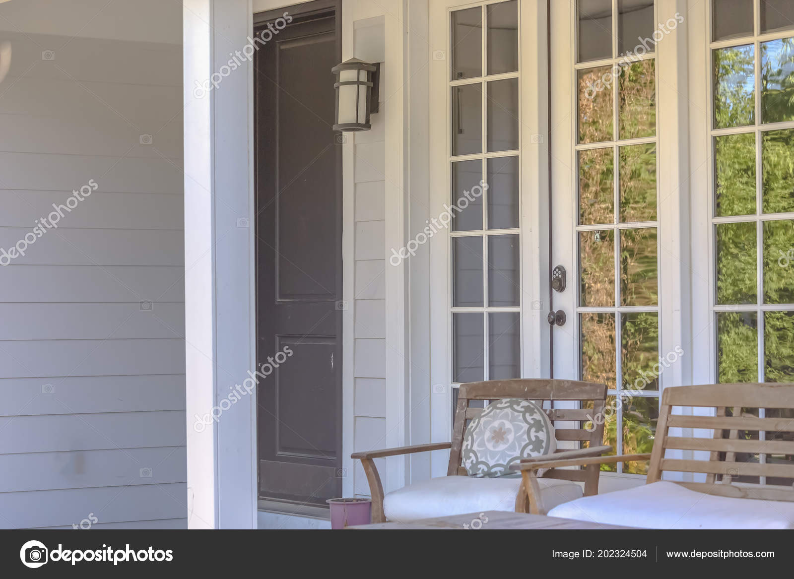 Front Door With Outdoor Seating Stock Photo Dropthepress