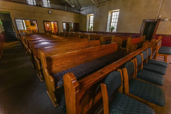 Views of Pews in Park City Utah church or chapel. Empty seats in church in the middle of the day with soft light.