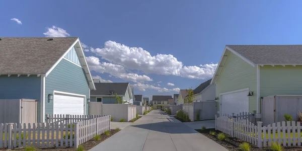 Rows of houses under blue sky and clouds in Utah