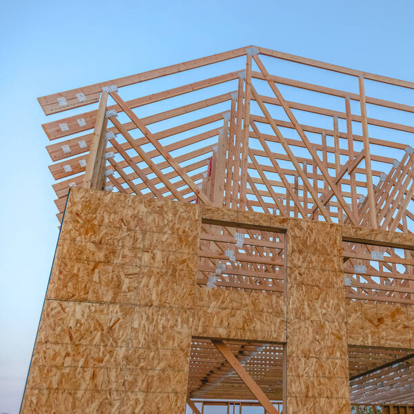 Looking upward at new building construction square