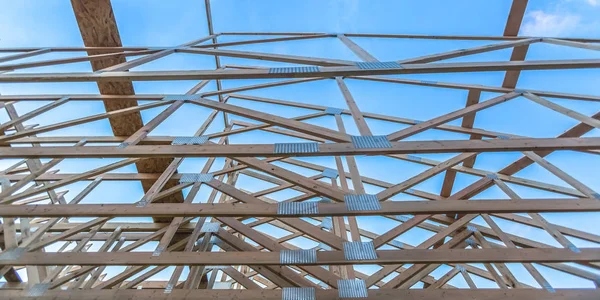 Roof beams of a new wooden construction pano