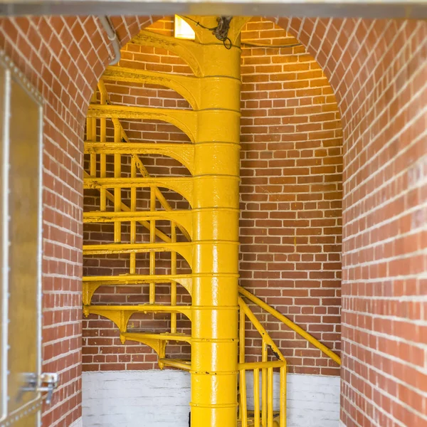 Yellow stairs and arched entry way of lighthouse — Stock Photo, Image