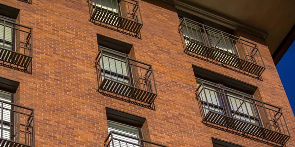 Balconies of a red brick building i