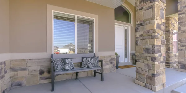 Patio of a house with a bench and pillows in Utah