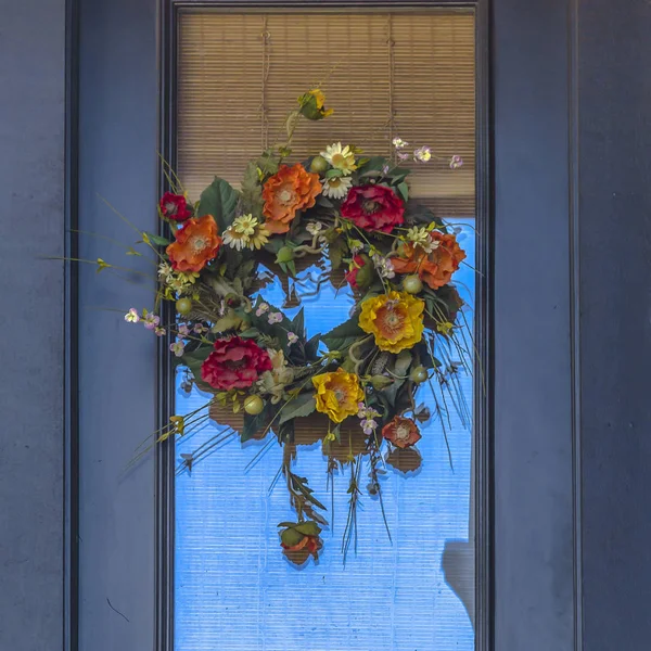 Decorative flower wreath hanging on a door