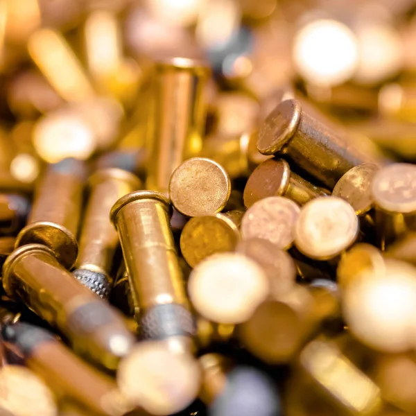 Numerous golden bullets heaped together — Stock Photo, Image