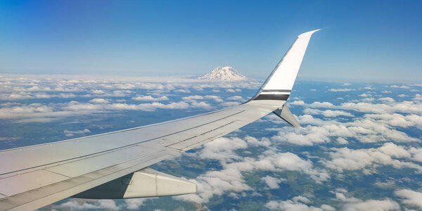 Airplane flying over Mount Rainier in Washington