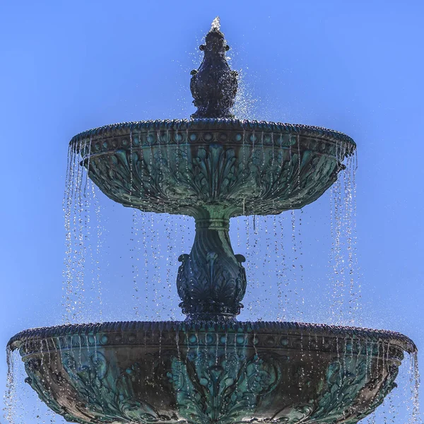 Beautiful tiered fountain with blue sky late day — Stock Photo, Image