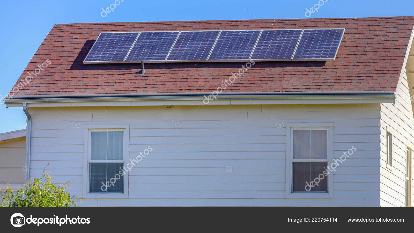 Solar panels mounted on the red rooftop of a home — Stock Photo