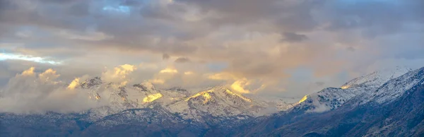 Lone Peak mountain partially covered with clouds