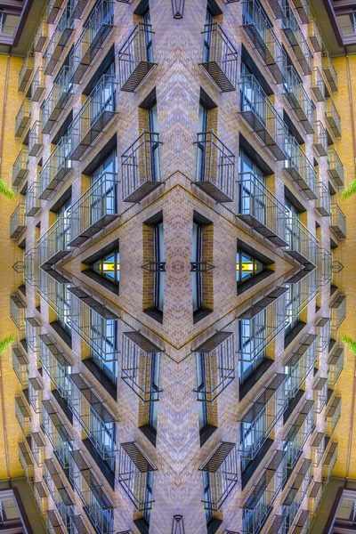 An apartment complex balconies with complex design. Geometric kaleidoscope pattern on mirrored axis of symmetry reflection. Colorful shapes as a wallpaper for advertising background or backdrop.