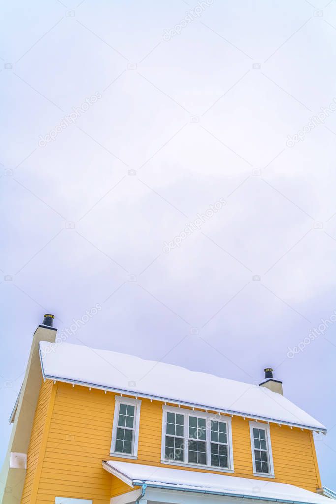 Home with snowy roof against sky in Daybreak Utah