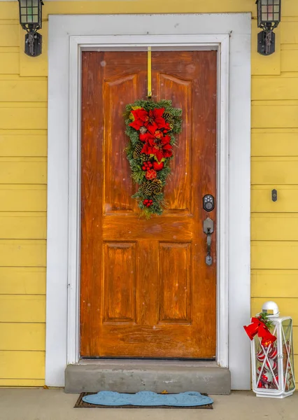 Front door with Christmas decoration in winter