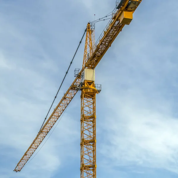 A Construction tower crane with sky background