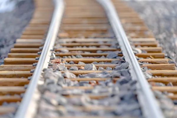Close up of a railway track on a rocky terrain