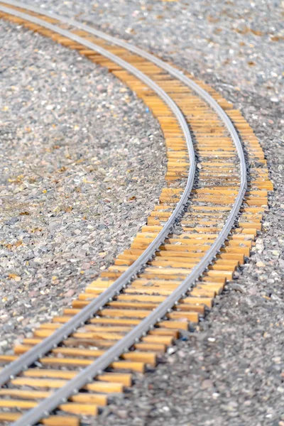 Railway on rocky ground viewed on a sunny day