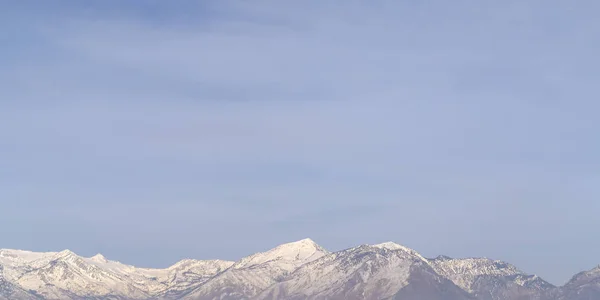 Snow capped Mount Timpanogos against sky in Utah