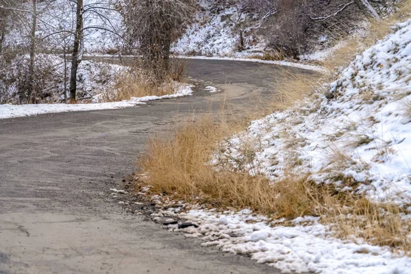 Narrow road on snowy mountain in Salt Lake City