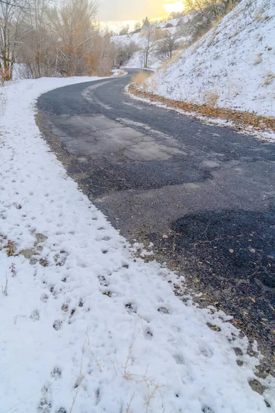 Weathered road on snowy mountain in Salt lake City