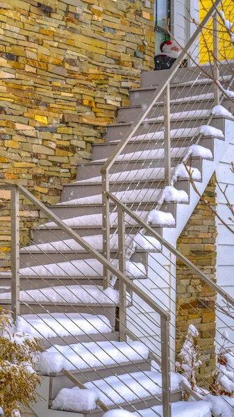 Clear Vertical Snowy outdoor stairs of home in Daybreak Utah