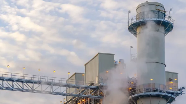 Clear Panorama Steam emitted from a Power Plant in Utah Valley against cloudy blue sky