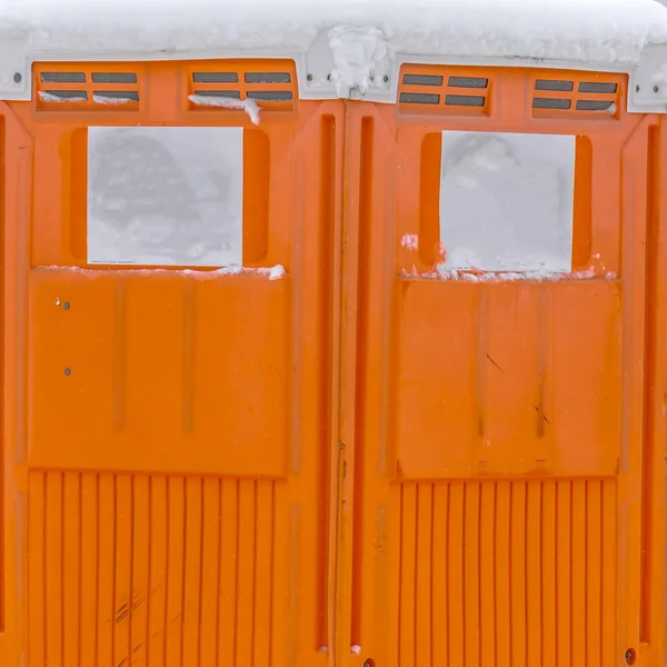 Clear Square Close up view of a bright orange portable restroom in Daybreak Utah — Stock Photo, Image