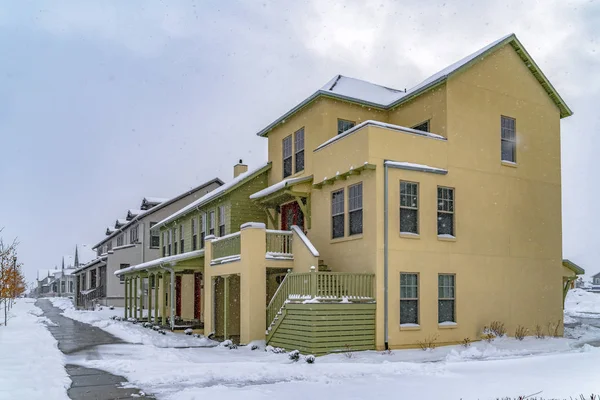 Wet and snowy pathway in front of adorable homes in Daybreak Utah — Stock Image Wet and snowy pathway in front of adorable homes in Daybreak Utah Stock Image