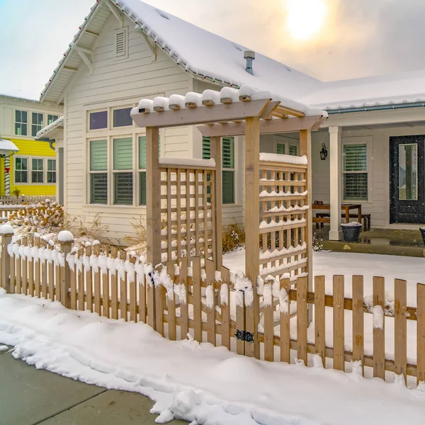 Clear Square Winter home with pergola on the wooden gate