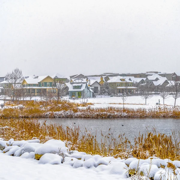 Clear Square Panorama of a lake in Daybreak Utah with wooden decks and snowy shore in winter