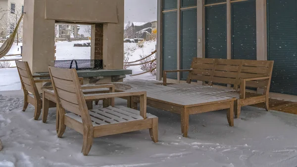 Clear Panorama Snow covered patio of a clubhouse in Daybreak Utah