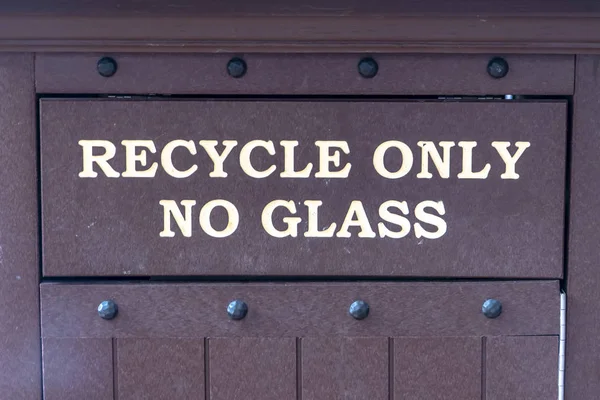 Recycle Only No Glass sign on a trash can