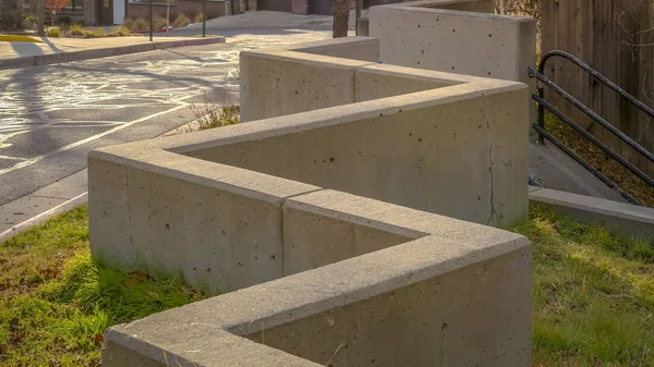 Panorama Outdoor stairs connected to a zig zag concrete barrier