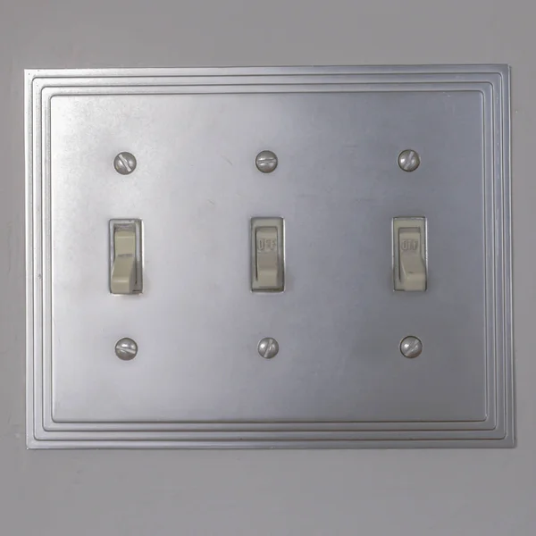 Square Close up view of vertical flip toggle light switches in o — Stock Photo, Image