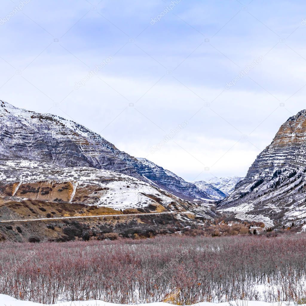 Square frame Panoramic view of an immense mountain dusted with s