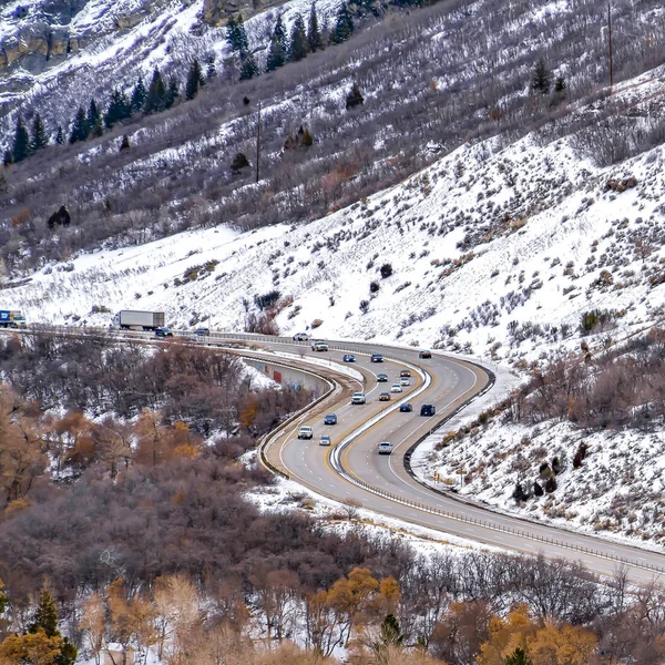 Frame Square Panorama of a road that winds through an immense mountain with snow in winter — Stock Photo, Image