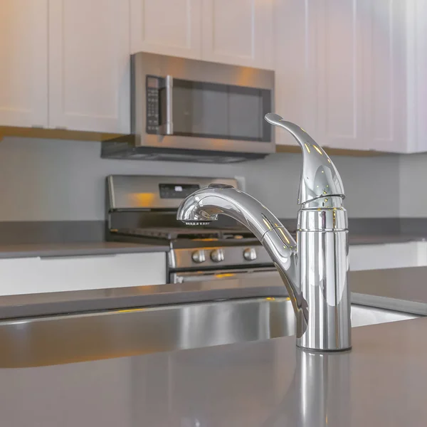 Frame Square Modern kitchen interior with faucet and sink on the glossy countertop — Stock Photo, Image