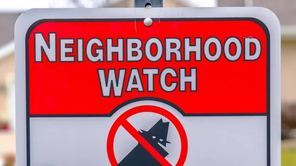 Panorama frame Close up of a Neighborhood Watch sign against a blurred background