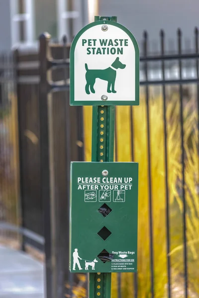 Pet waste station with dog bag dispenser