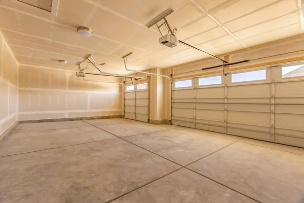 Interior of the empty garage of a home with unfinished walls and ceiling — Stock Photo, Image