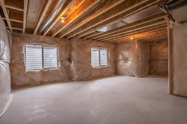 Windows and air conditioning ducts inside a new home under construction — Stock Photo, Image