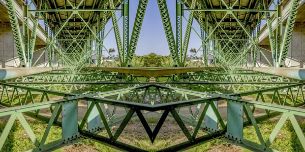 Symmetrical design created from doubling a photo of a green bridge in California — Stock Photo, Image