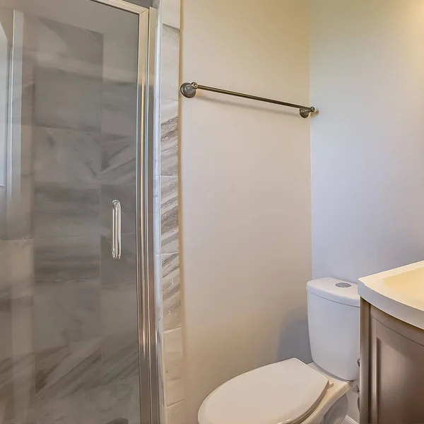 Square frame Bathroom interior of a home with toilet sink and cabinet against the white wall — Stock Photo, Image