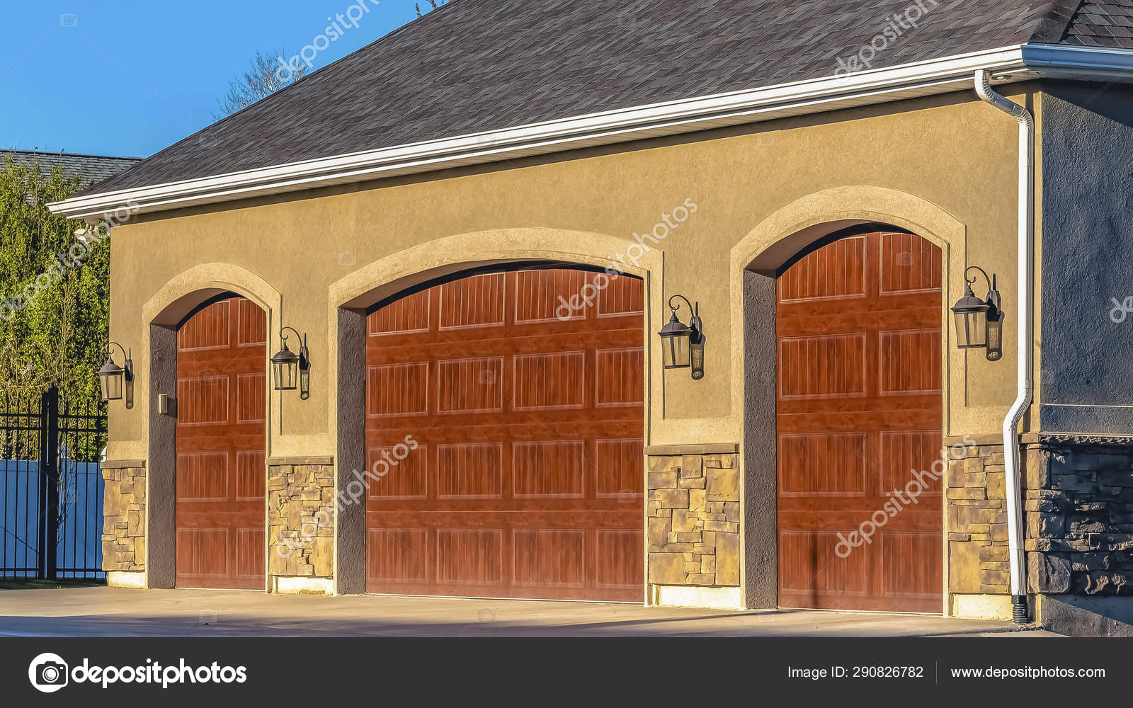 Panorama Frame Home Exterior With Brown Wooden Garage Doors